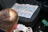 Следователи полиции требовали взятку в 10 тысяч долларов США